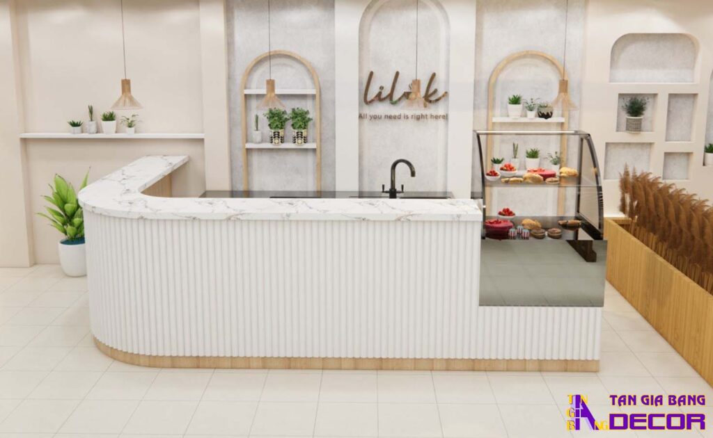 Tổng hợp 50 mẫu thiết kế quầy trà sữa đẹp! 38 Quầy chữ L bo góc theo lam nhựa trắng với tủ kính.