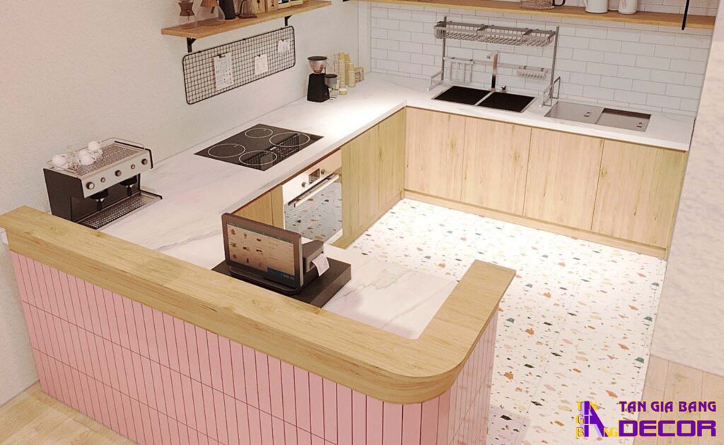 Tổng hợp 50 mẫu thiết kế quầy trà sữa đẹp! 42 Quầy chữ L bo góc với mặt trước ốp giả gạch màu hồng.