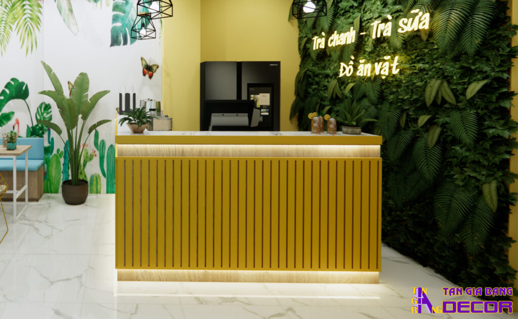 Tổng hợp 50 mẫu thiết kế quầy trà sữa đẹp! 15 Quầy trà sữa giá rẻ chữ L với mặt trước ốp lam nhựa màu vàng.