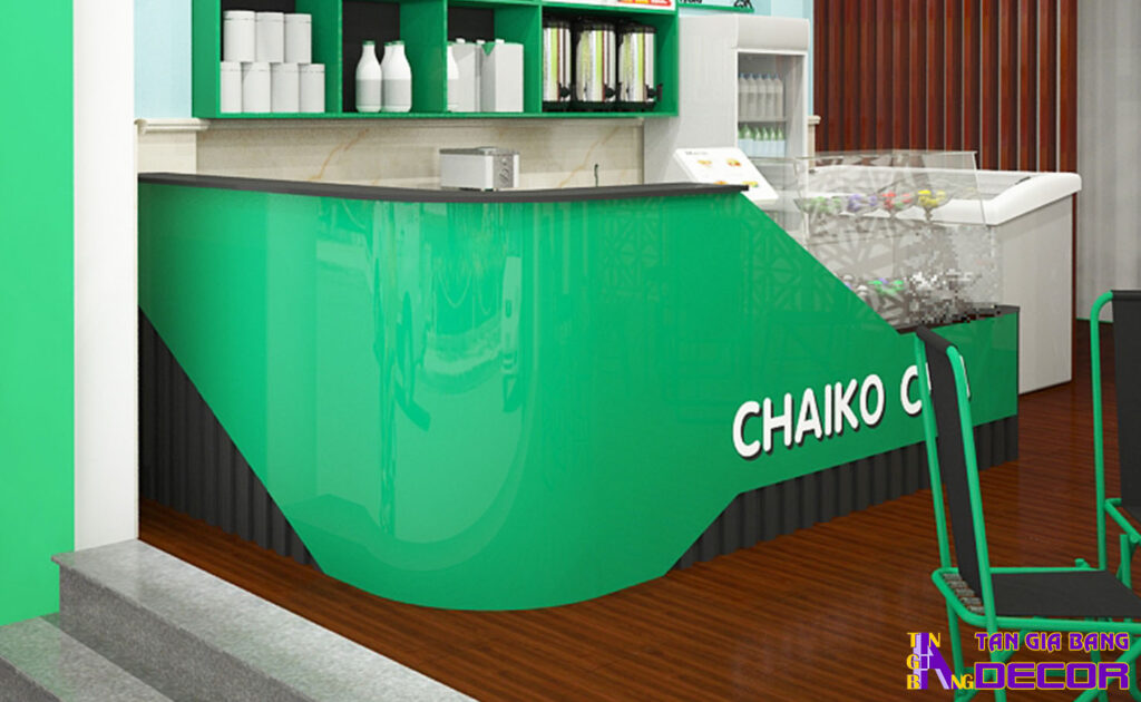 Tổng hợp 50 mẫu thiết kế quầy trà sữa đẹp! 43 Quầy chữ L bo góc với mặt trước ốp mica sơn xanh lá.