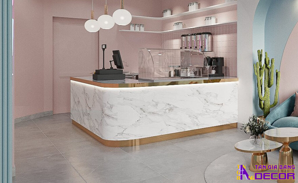 Tổng hợp 50 mẫu thiết kế quầy trà sữa đẹp! 44 Quầy chữ L bo góc với mặt trước dán giả đá.